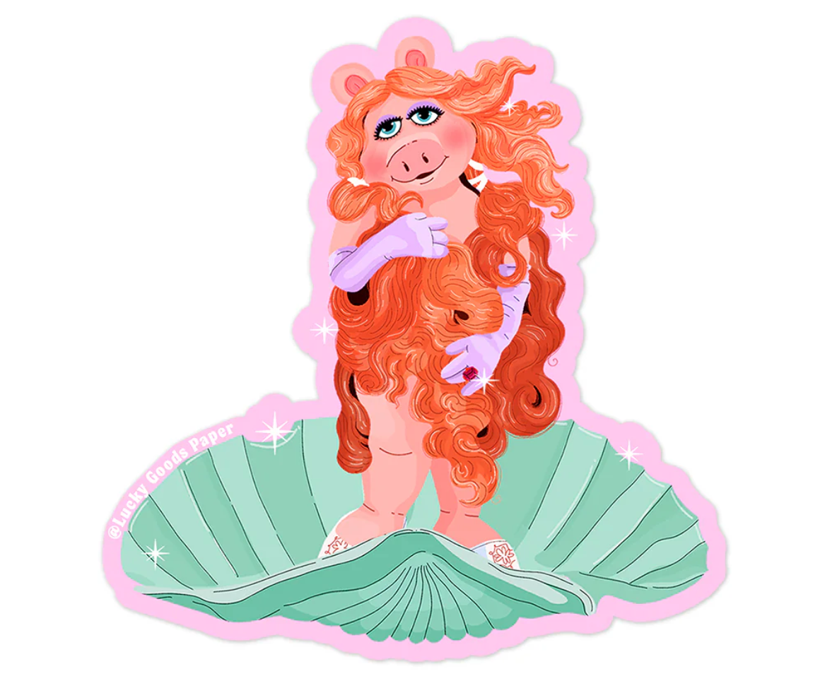 Mermaid-themed character with red hair and a green tail on a white background