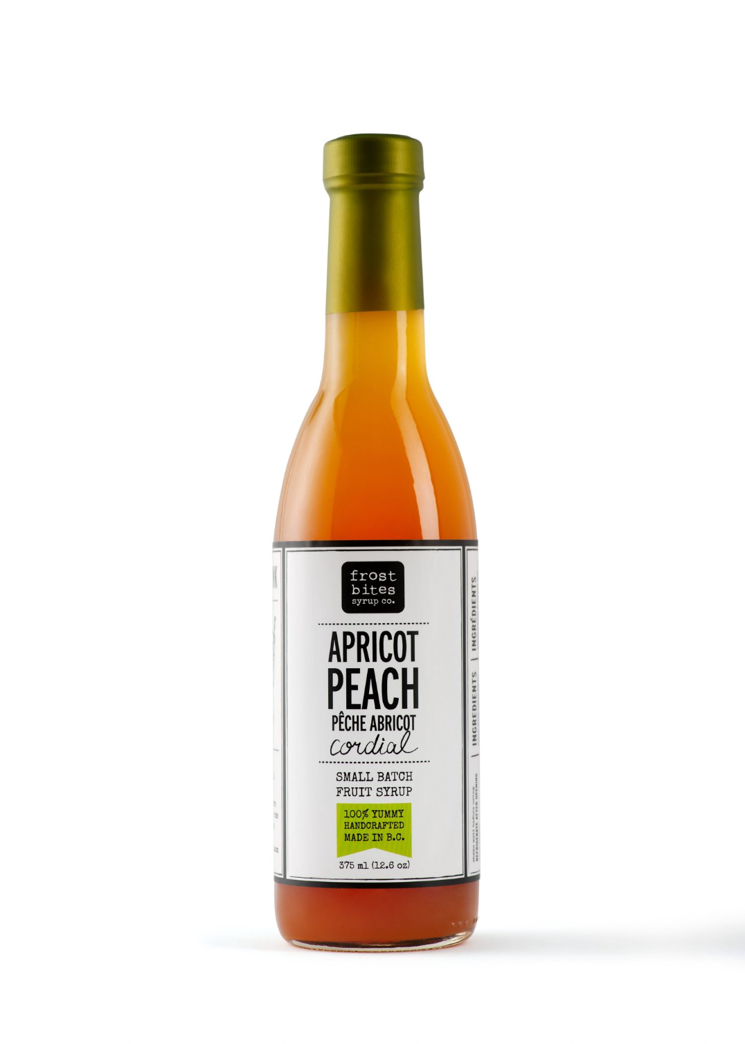 A bottle of Frostbites peach syrup with a white label, indicating the flavor of the syrup.