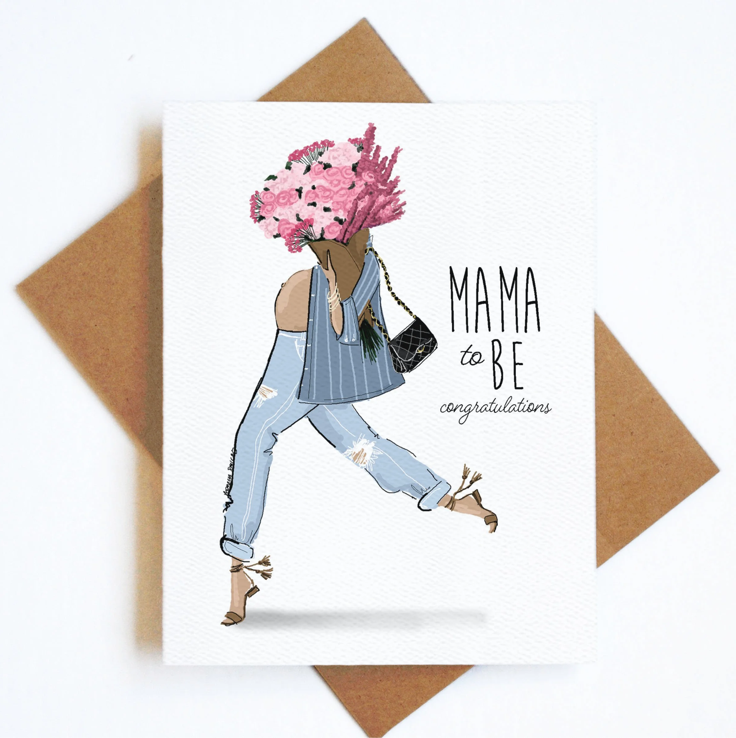Greeting card with illustration of a pregnant woman with flowers and 'Mama to Be' text, on a white background with brown envelope.